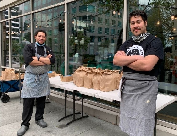 Looking to give back and support unemployed restaurant workers, chef Nelson German (left) partnered with The LEE Initiative to offer more  than 100 free meals five days a week out of his Oakland-based alaMar Kitchen  & Bar.