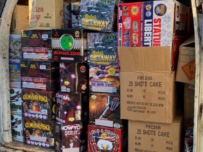 Police say the men were selling the fireworks out of the back of a van.
