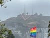 Fog rolls in above the 26th Pink triangle, installed on Twin Peaks in San Francisco on May 29, 2021. The triangle will be illuminated nightly in June by 2,600 LED nodes for Pride Month.