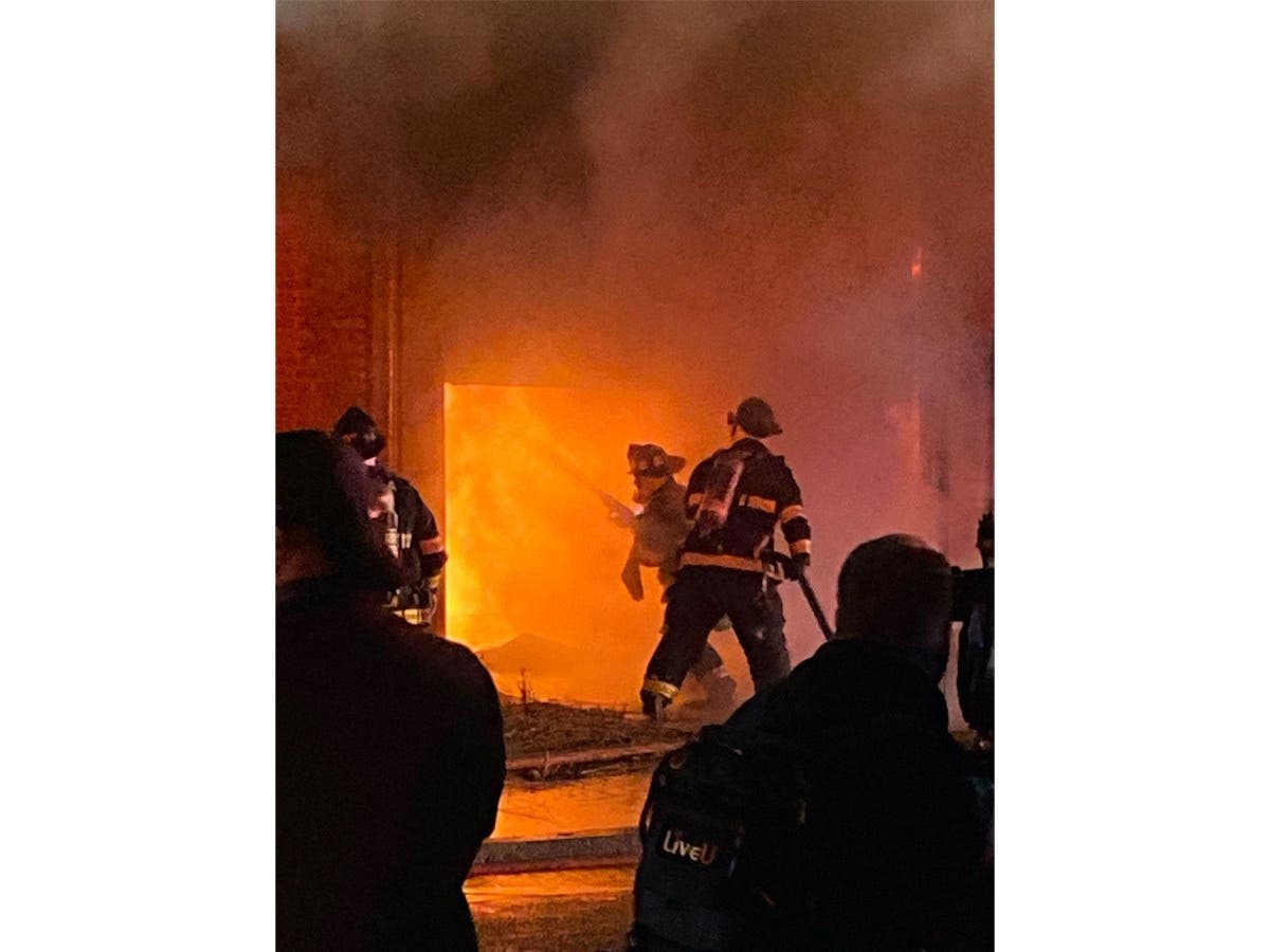 Firefighters battle a roaring fire at a marijuana grow operation in San Leandro, Calif.