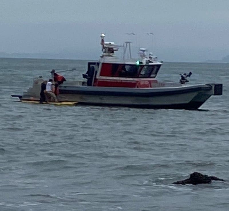 SF Fire Department teams on land and water rescued 2 teenagers at China Beach who had become trapped on a cliff after the tide came in on July 4, 2023. 