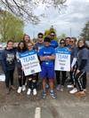 South Amboy High School Students volunteer at race and congratulate first place winner Rafael Albarran