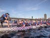 20 paddlers, 1 drummer, 1 steerperson working in synchrony to propel a 40 foot DRAGON BOAT weighing 2,250 kg fully loaded