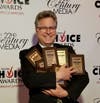 NSYMCA President/CEO Howard Schultz holds award for 11 categories at the North Shore Choice Awards.