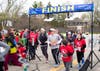 Runners and walkers start the Healthy Kids Day 5K race.