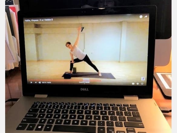 Debbie Belkin teaches a Vinyasa Yoga class, available for free online from the North Suburban YMCA.
