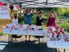 The NSYMCA Strong Kids Fundraiser included a special “Gift Basket” pick-up table.  Seen here from left are Sandy Veith, Jerry Nolan, Cathy Gregory, and Debbie Madeley.  