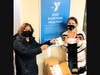 North Suburban YMCA donated 1,000 masks to Curt’s Café, a Lake County agency focused on improving the lives of young adults living in at-risk situations.  Shown: Gayle Nelson from Curt’s Café (left) and Tara Wesselink, North Suburban YMCA.