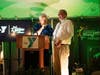Ron Bernardi (left) of Sunset Foods honoring Henry Fetta (shown here) and Dan Jariabka who were recognized for their work with the Hunger Resource Network, winning the 2021 Ken and Alta Thiel Award for Social Responsibility and Leadership.