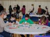 A family creating personal messages for the “Blessing Bags” at the 2021 NSYMCA Holiday Giveback event. 