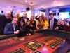 Casino participants enjoy a game of craps at the 2022 North Suburban YMCA annual Community Strong Fundraising Dinner and Casino Night.
