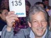 Charlie Corrigan Northbrook resident and store manager at Sunset Foods raises his bidder number in effort to raise money for the North Suburban YMCA.