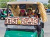 Caption: (from left) Northbrook residents Abbie Lyman and Jenna Dickson celebrate in their decorated “Tiki Bar” golf cart, one of the winners of best dressed team at the North Suburban YMCA’s Community Strong Golf Fundraiser.