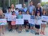 (Back) Kathy Fielding, Rep Morgan, Congressman Schneider, Senator Morrison visit with Y campers (Front) Violet Walter, Gabby Wilkins, Madison Albores, Christopher Jin, Leo Huangbo, Jacob Mintz, Barrett Slutsky, Alice Kuby, Ryan Sansoterra, Lili Cherubin. 