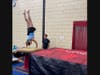 Caption:  Alayna Drozt practices on the new air bag while Jordan Levy, NSYMCA’s Head Gymnastics Coach, spots her flip