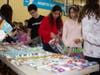 Caption:  With over 150 volunteers, families of all ages pack blessing bags for the homeless at the North Suburban YMCA on Dec 9th.