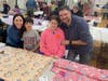 CAPTION 1:  The Finder Family Volunteer to make Fleece Blankets at the NSYMCA Fleece for Fur Babies Event on March 10th.  Left to Right:  Michelle, Aiden, Elayna and Matt Finder from Northbrook.