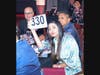 At the Din table, Northbrook resident Kruti Jain, raises her bidder number high and won a Live Auction Prize in effort to raise money for the North Suburban YMCA.