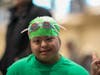 Caption:  The NSYMCA Flying Turtles participant, Melanie Martinez, age 17 joyfully gets ready for her swim meet.