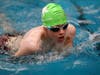 Caption: Adyn McGuiness from the NSYMCA Special Olympics Flying Turtles races to the finish line.