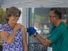 Asim Javed from Ascension Hospital administers a flu shot to Karen Brownlee at the Y’s Walk-Up immunization clinic on September 18th.