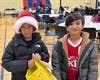 Jeremiah and Miles, Northbrook residents and Y summer campers help pack blessing bags for the homeless at the NSYMCA Holiday Giveback on Dec 7th.  