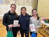 Amanda Fielding, Age 14, Madi Murphy, age 13, Quinn O’Malley, pack blessing bags at the NSYMCA for their volunteer service hours.