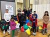 Caption:  With over 100 volunteers, participants of all ages pack blessing bags for the homeless at their annual Holiday Giveback at the North Suburban YMCA on Dec 7th.