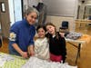 CAPTION 2: (Left to right) Ellie Foreman and her daughter Alex, Age 7 and her friend Charley, age 8 work hard to create their blanket at the NSYMCA Fleece for Fur Babies Event at the Y in Northbrook on March 9th.  They go to Greenbriar Elementary.