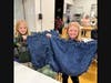 CAPTION 3:  Mary Pickut, age 10 and Carley Nelson, age 11 show off their finished blankets at the NSYMCA Fleece for Fur Babies event on March 9th.  Both are 5th graders at Meadowbrook Elementary in Northbrook.