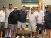 At the NSYMCA’s Community Strong Golf Fundraiser the “tied” winners of Lowest Scoring team show off their trophy. (from left) Ryan Liebgott, Patrick Livengood, Patrick Niday, Chase Noonan, Howard Schultz, Alex Williams and Patrick Tatarek.