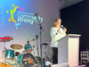 Kathy Fielding, CEO of the NSYMCA, welcomes guests with the Y’s impact videos of the night at the NSYMCA’s 20th Community Strong Fundraising Concert.