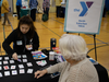 Jasmine Lee, NSYMCA’s coordinator for their Y.E.S (YMCA Education Series), plays the game ‘Set’ with a YMCA member at the NSYMCA’s SeniorPLAYooza event on May 13th. 