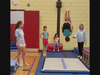The North Suburban YMCA Gymnasts try out the new AirFlow Pro Mat donated through the Ruth Schultz Bright Days Fund.  (Left to right) Coach Ella Quinlan, Izabela B. (age 9), Nora W. (age 9), Hannah P. (age 10) and Kelly Rao, NSYMCA Gymnastics Director.