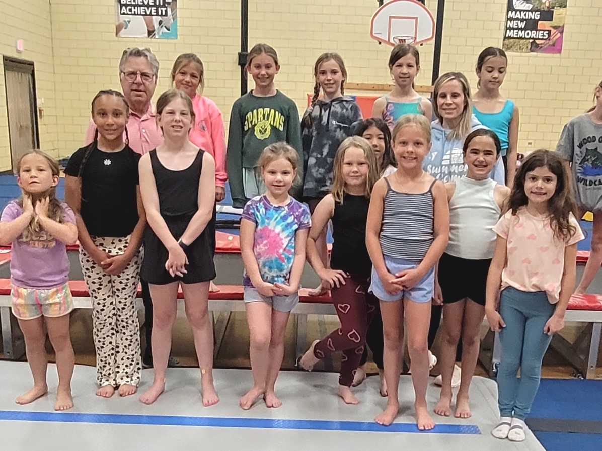 The NSYMCA Gymnastics Team awarded a grant by the Ruth Schultz Bright Days Fund (Top) Howard Schultz, Nikol, Emma, Charlotte H., Izabela, Kelly Rao, Hannah (Bot)- Quinn, Lauren, Noa, Julia, Colbie, Eloise, Charlotte R, Gracelyn, Nora
