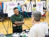 The NSYMCA’s 10th Annual SeniorPalooza Health and Fun Fair featured over 60 vendors including Ryan Caturan from Illinois Bone and Joint Institute, who talks with a guest about the importance of balance and pain free movement.