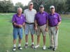 Many of the golfers wore purple to support domestic violence awareness.