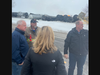 Gov. Tim Walz visits with emergency responders and officials at the train derailment site in Raymond, Minnesota.