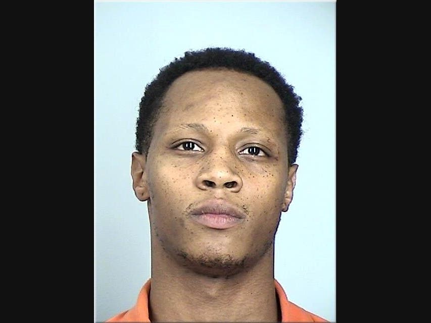 A repeat violent offender who carjacked an Uber driver and fired at him as he fled on foot was sentenced to more than 14 years in federal prison, prosecutors announced Tuesday.