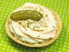 Pickle Pie — LuLu's Public House fills a pie crust with chopped pickles, pickle juice and cream cheese, then tops it with a ranch and Cholula frosting and a dill garnish.