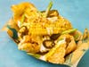 Cracklin' Corn Ribs — The Blue Barn batters and fries corn cob quarters, then piles on bacon ranch, green onion, candied jalapenos and pork rinds.