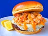 Surf 'N' Turf Burger — Cafe Caribe tops a grilled beef patty with garlic-herb lobster and pepper jack cheese on a toasted brioche bun.