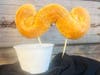 Butter Brew Mustache Pretzel — Blue Moon Dine-In Theater shapes soft pretzel dough into a mustache and coats it in a caramel-vanilla-butterscotch butter brew mix.