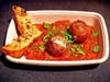 Shakshuka Lamb Meatballs — French Meadow Bakery & Cafe stuffs lamb and pork meatballs with whipped goat cheese and serves them over shakshuka sauce.