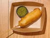 Hmong Corndog — Union Hmong Kitchen skewers a ginger, garlic and lemongrass Hmong sausage, batters it and fries it, made with Kramarczuk's.