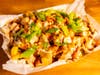 Jamaican Jerk Chicken Loaded Fries — Midtown Global Market's Irie Jamaican Express tops battered fries with jerk chicken, melted cheese and jerk sauce, available Aug. 27 through Sept. 1 only.
