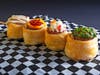 When Pigs Fly — Sausage Sister & Me wraps four pork sausage varieties in puff pastry, served on-a-stick.
