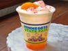 Sweet Peach Lemonade Sparkler — Quench'd layers fresh lemonade with peach syrup and peach cold foam, topped with popping candy.