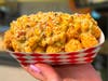 Elote Tots — Tot Boss tosses tater tots in Tajin and elote-style sauce with cotija cheese.