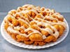 Pumpkin Bar Funnel Cake — Taulelle's Jurassic Corn Dogs blends real pumpkin into funnel cake batter, topped with cinnamon cream cheese frosting.

